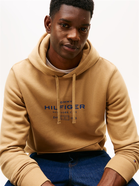 Brown Perfect for fighting the cold, this warm hoodie is enhanced with a stylish, tonal Tommy Hilfiger logo and crafted from high-quality interlock knit.  Men